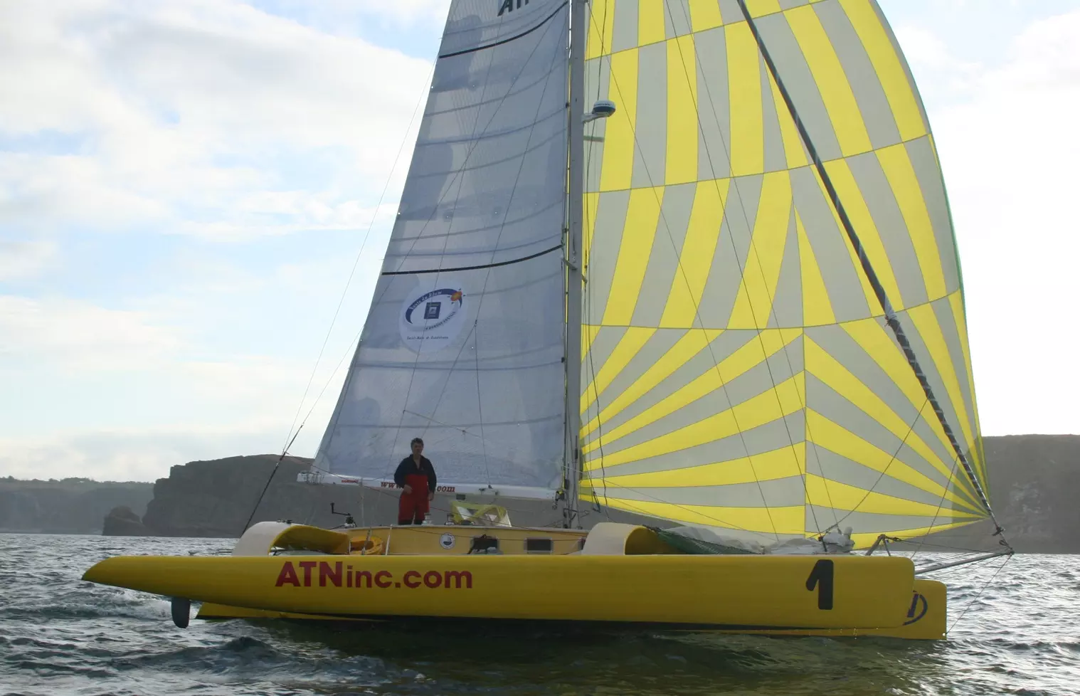 Etienne Giroire's 40-foot yellow trimaran ATNinc.com / Up my Sleeve under sail at the Route du Rhum 2010