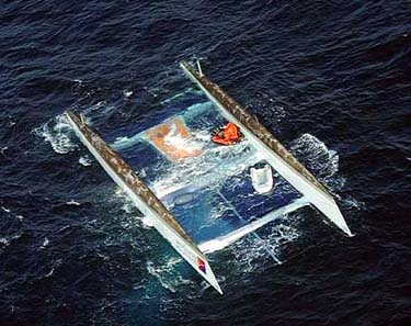 The capsized twin hulls of the 110-foot catamaran Spirit of Antigua, ex-Formule Tag, adrift in the Bay of Biscay