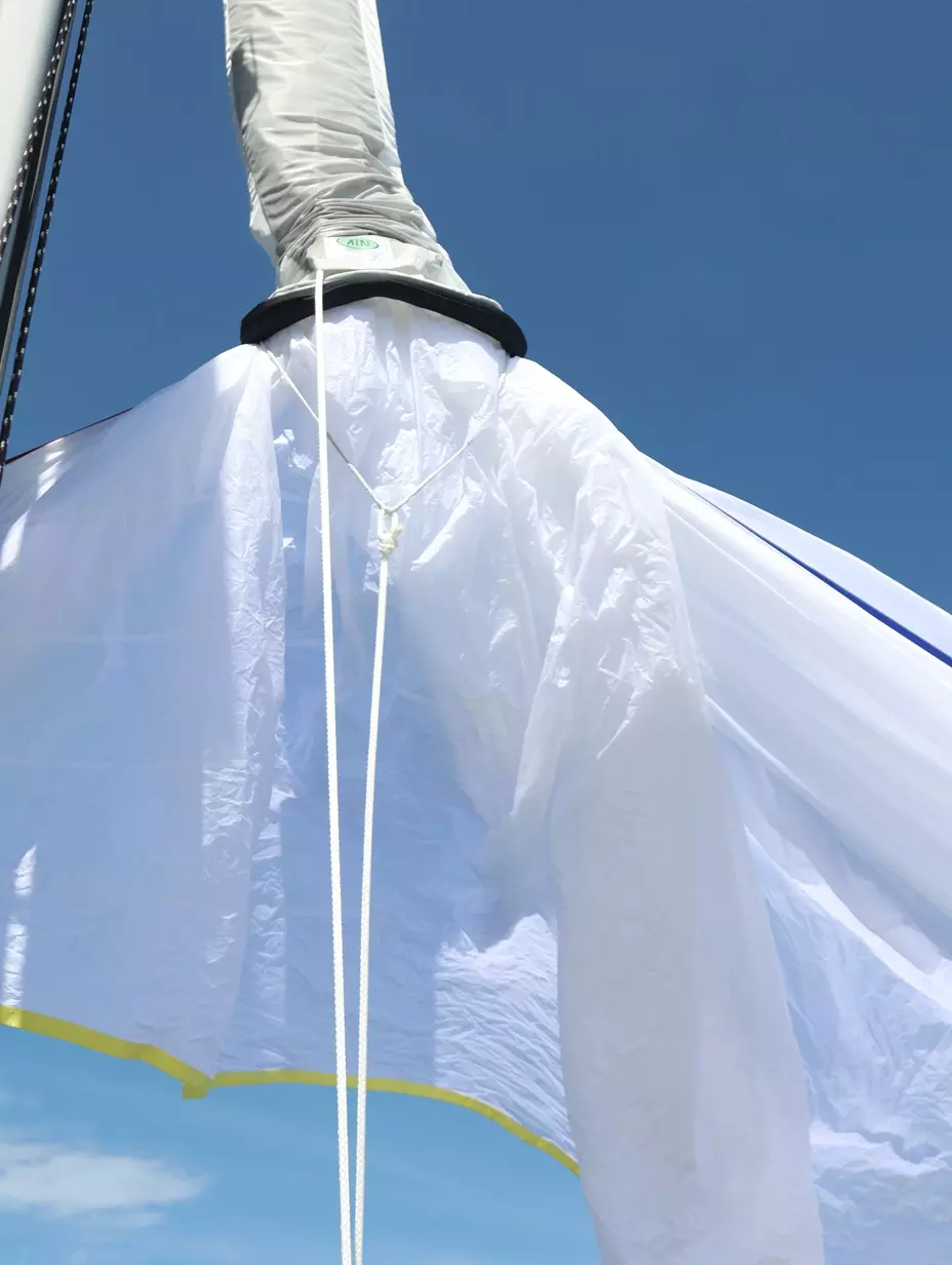 Current Generation 3 ATN Pennant - single-piece Dyneema Softie with dog bone, shown at the head of a spinnaker